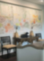Custom abstract triptych painting by Stephanie Evans installed in a contemporary dining room.