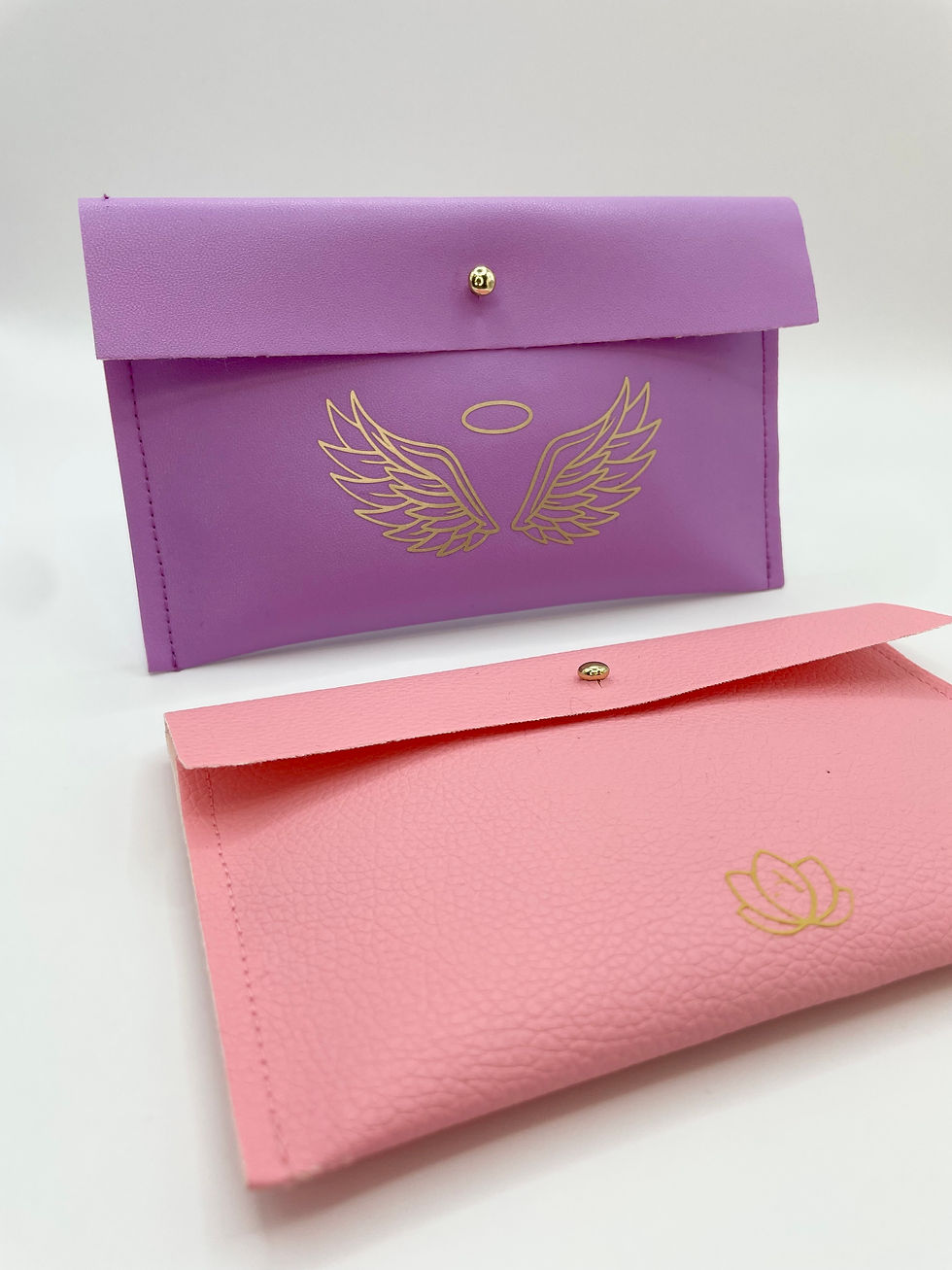 Thumbnail: purple pouchette with angel wings, pink pouchette