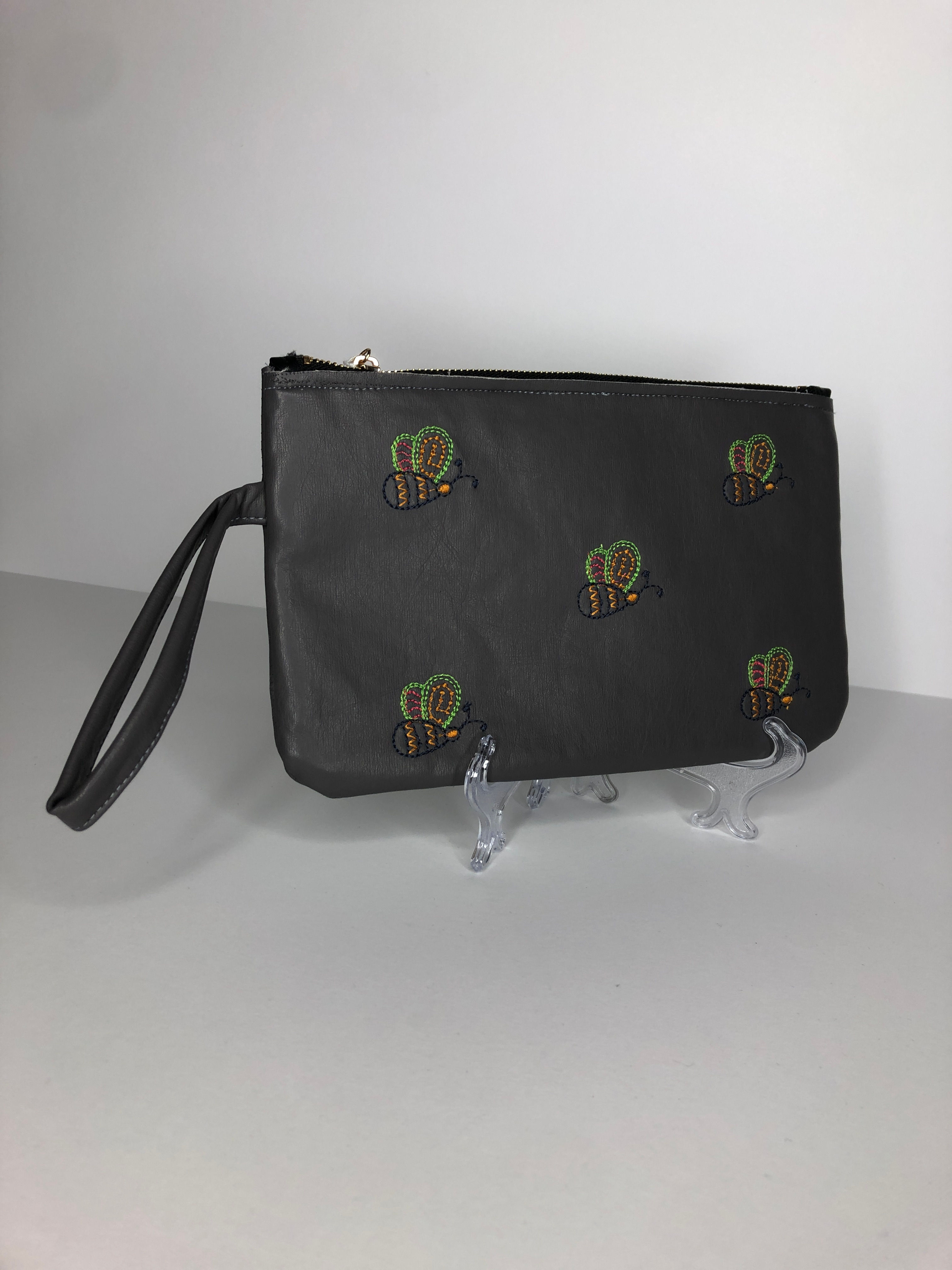 bee embroidered clutch bag