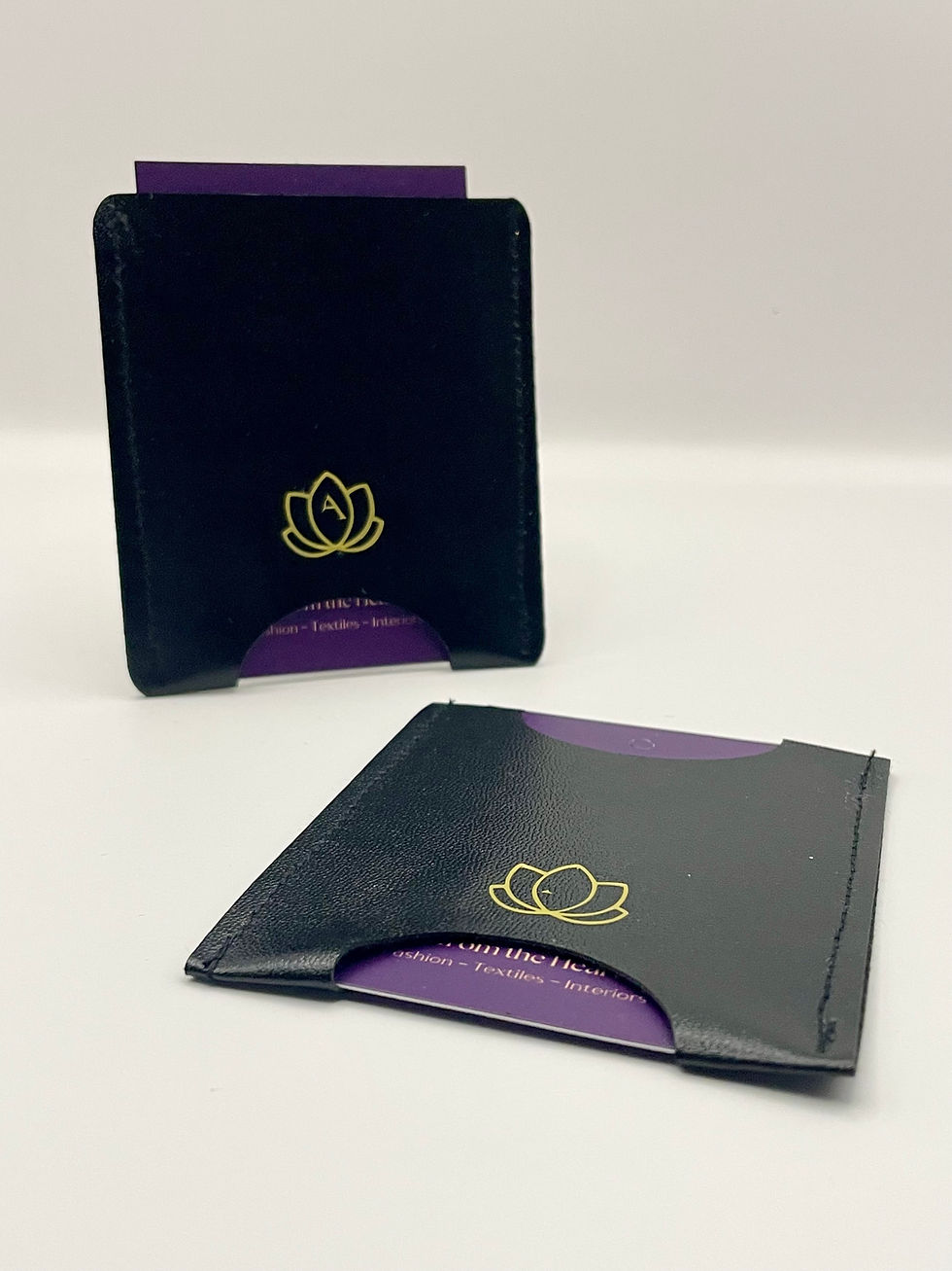 Thumbnail: black card wallet with lotus logo