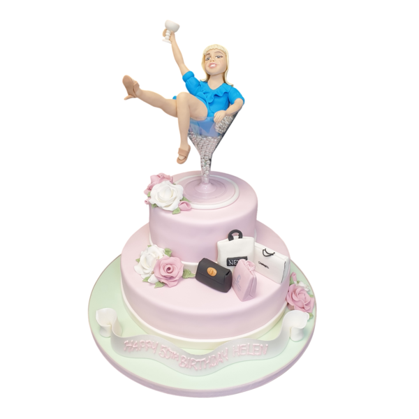 Bespoke cake shaped like a lady lounging in a martini glass, decorated with pink and white icing, Solihull, West Midlands.