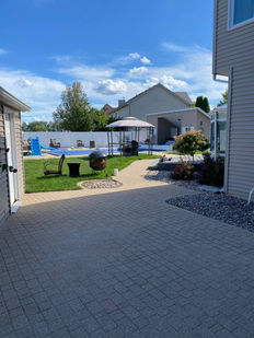 Tan paver patio leading to backyard pool in Limestone, IL 60901