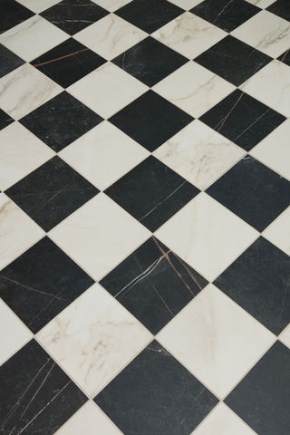black and white checkered tiles on a floor