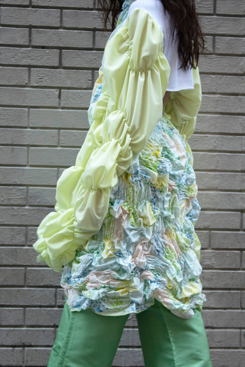 A ruffled dress in translucent colors.