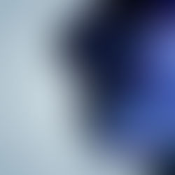 Silhouette of a young woman's profile with a galaxy pattern of blue and purple on the head, set against a light gray background, creating a dreamy, introspective mood.