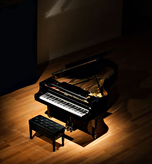 Piano on Dim Stage_edited.jpg