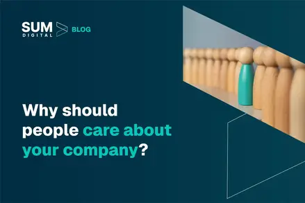 A photo of wooden figures with one painted in blue sticking out on a dark blue background