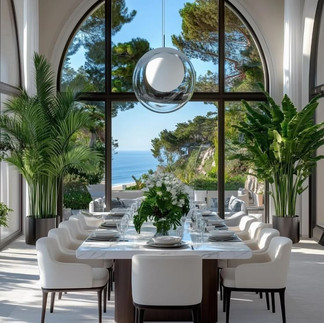 modern luxury dining room large dining table with twelve seats, white arm chairs in front of a large window looking to the sea