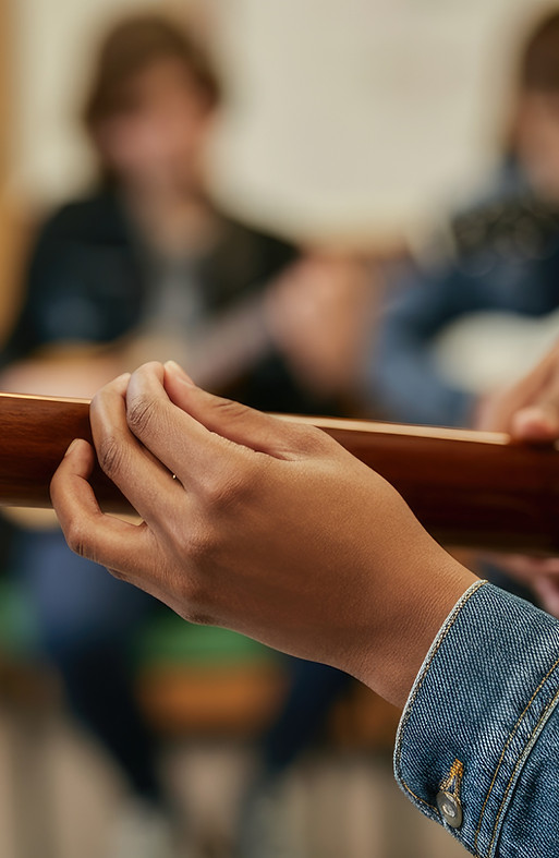 vecteezy_group-of-people-playing-guitar-during-music-session_73861117.jpg
