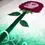 Thumbnail: Long shot of women's face surrounded by rose petals, incantation wrapped around stem of flower.
