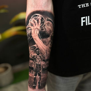 Dynamic sports motion realism tattoo featuring a detailed Football player capturing motion blur.