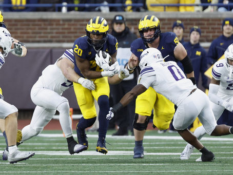Wildcats Silenced, Michigan Triumphs in Big House Blowout