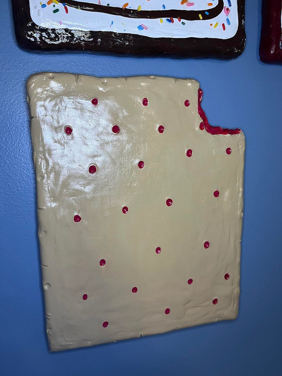 Thumbnail: unfrosted strawberry toaster pastry 8" x 10" *bite missing