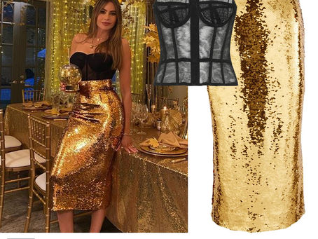 Sofia Vergara's black bustier top and gold sequin skirt