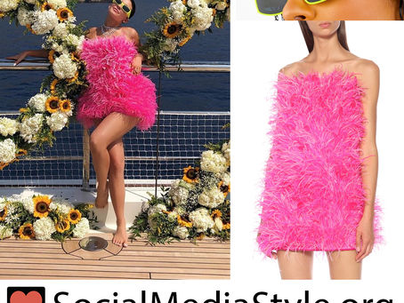 Kylie Jenner’s yellow sunglasses and pink feather dress