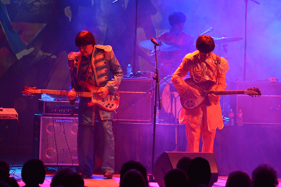 Yesterday Beatles tribute performing dressed in "Sergeant Pepper" costumes.