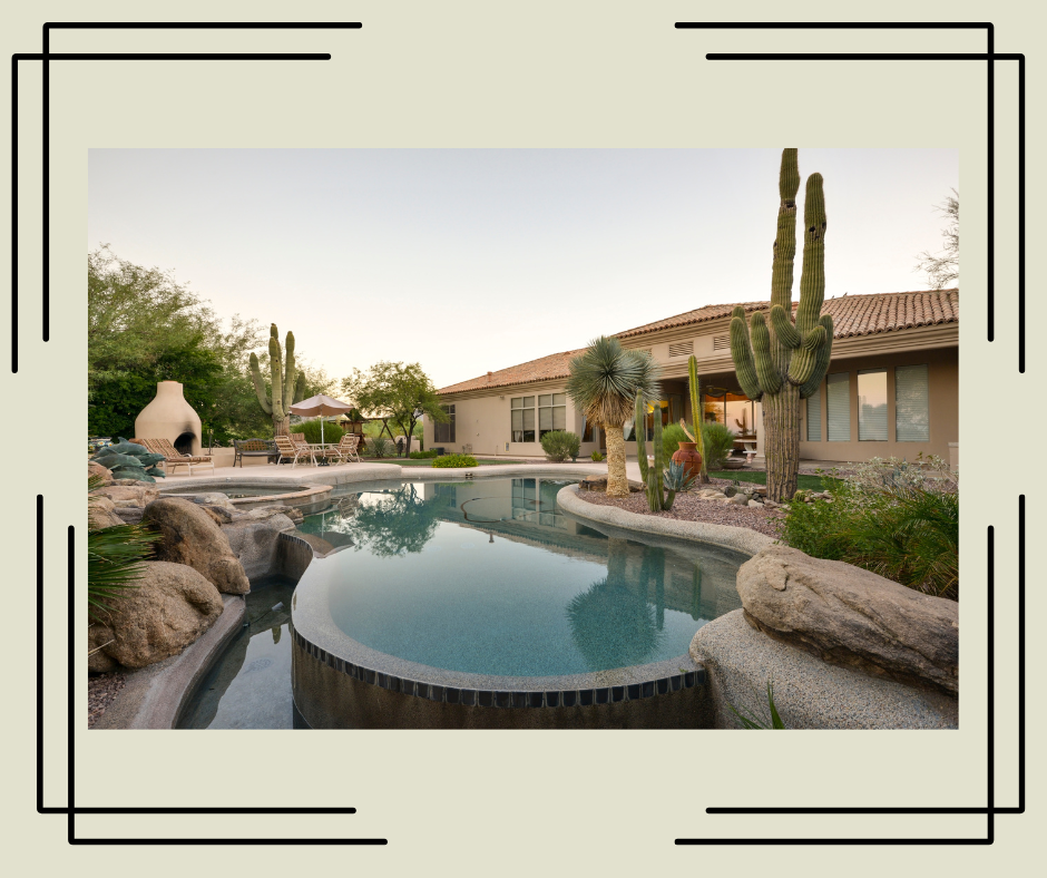 Desert landscaped backyard with pool and cacti