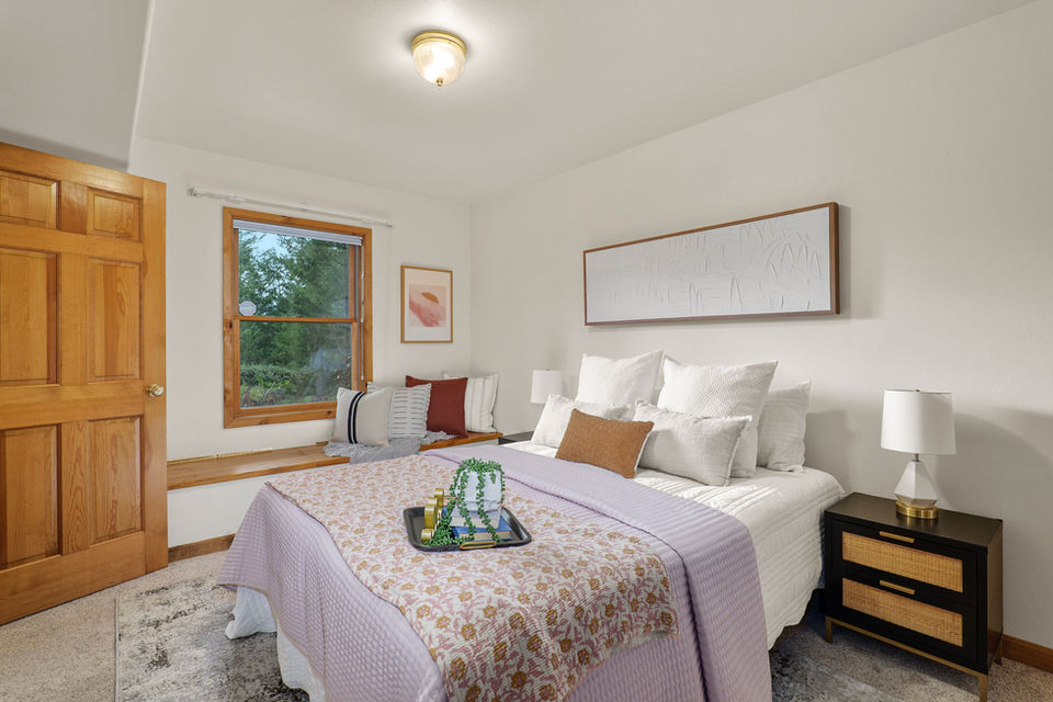 Bedroom window bench with storage in timber-style Oregon home