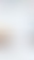 Glasses and pencils on car sketches with a notepad in a bright workspace. The scene is creative and focused, with a modern atmosphere.