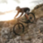 man-riding-bike-on-rocky-slope-at-sunset-2025-03-16-12-42-01-utc_edited