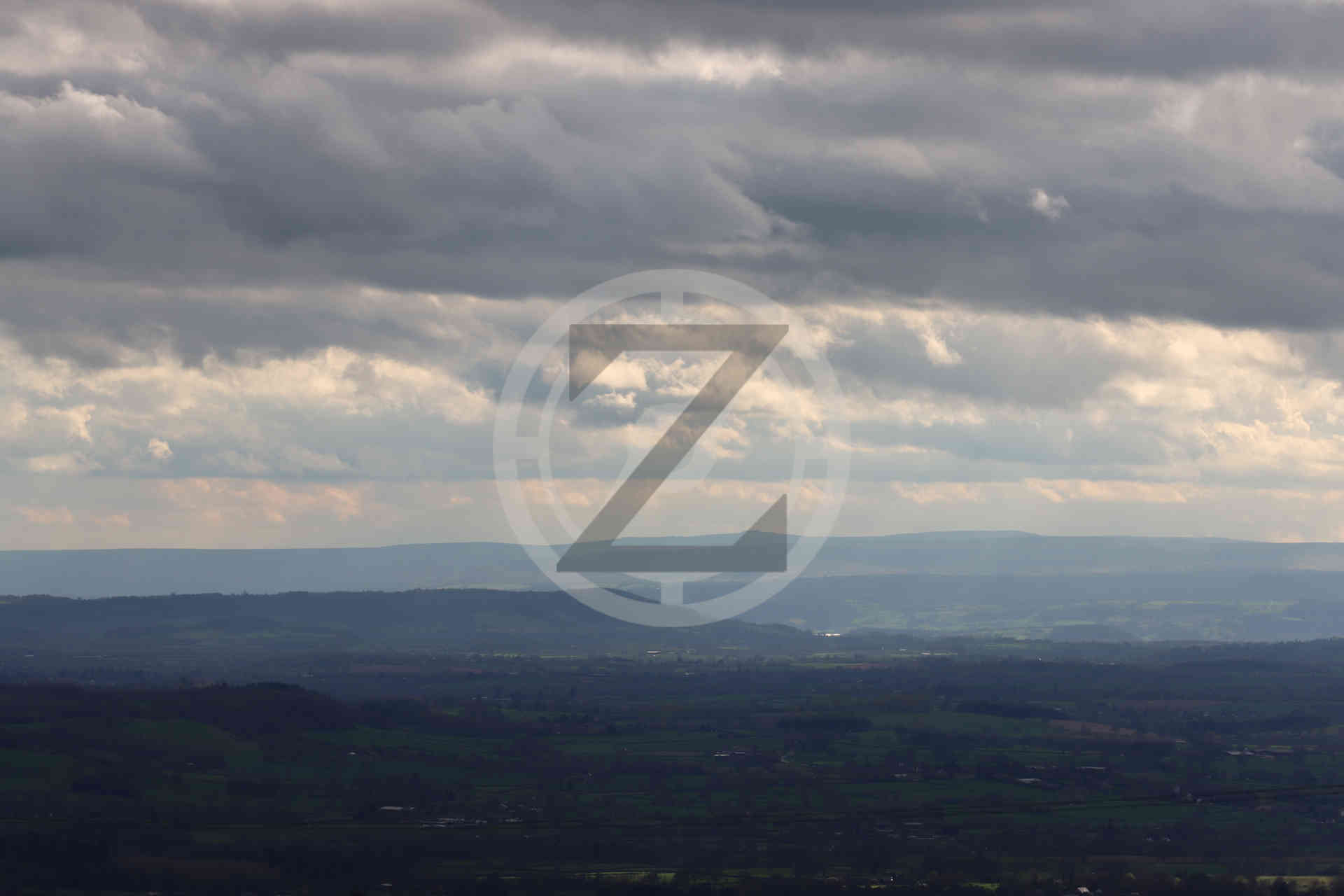 sun rays through a dark sky