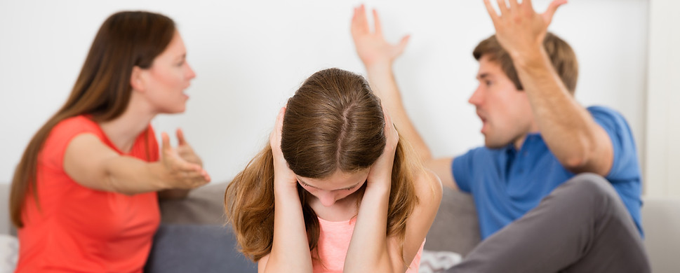 Parents Arguing In Front Of Their Child 