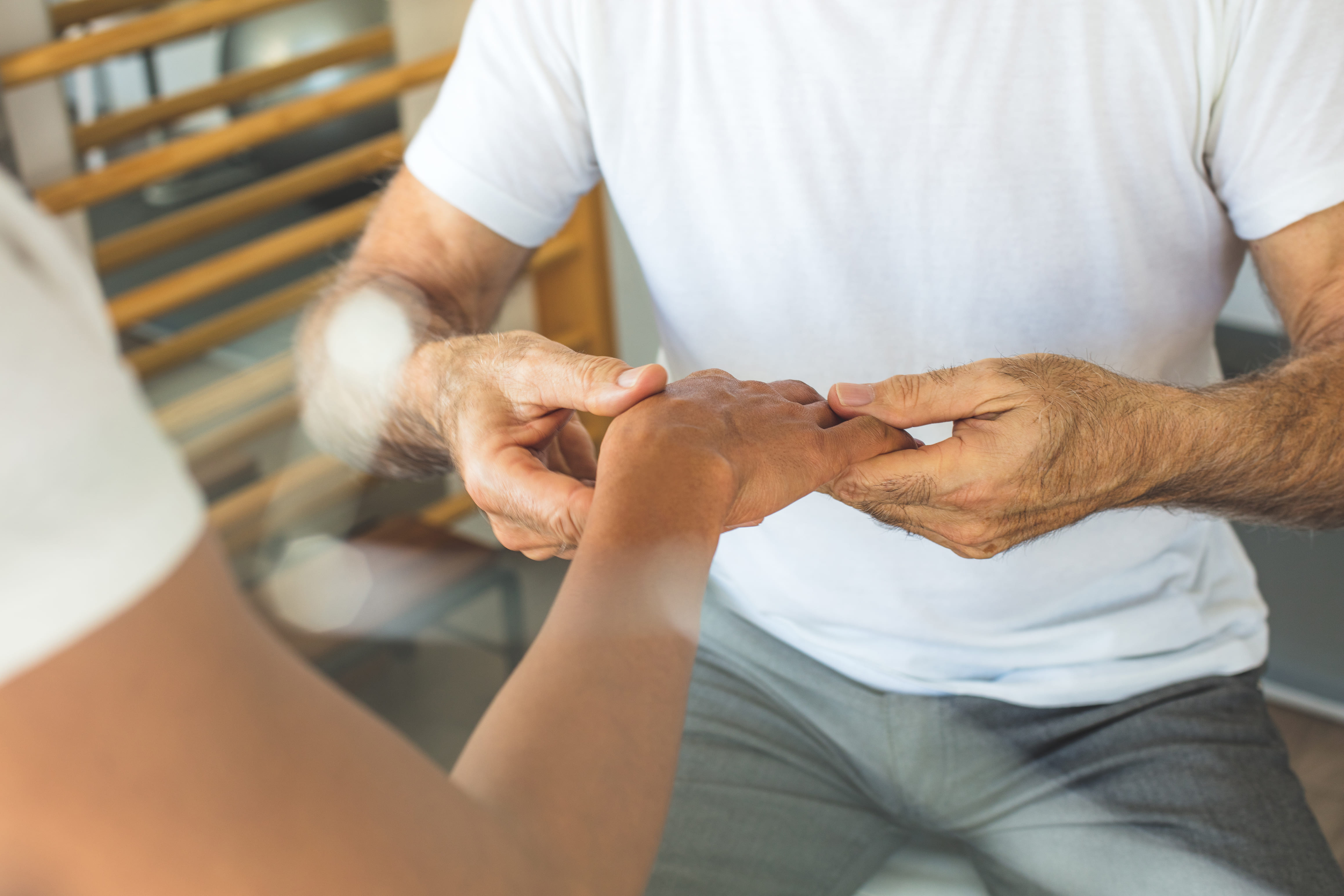 I will help you. Physiotherapist working with patient.