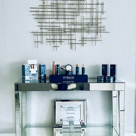 SkinBetter Science products displayed on mirrored console table.