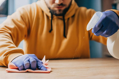 close-up-portrait-mans-hands-with-rubber-gloves-wiping-wooden-table-man-doing-some-cleanin