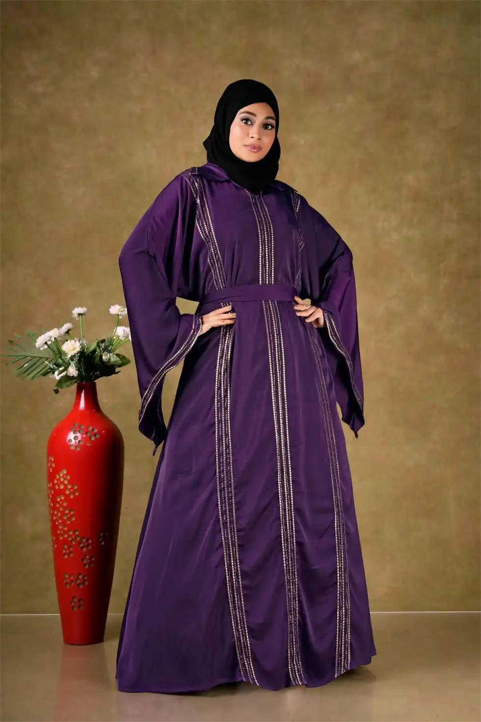 Full-length view of a Royal Collared Jalebiya Gown with intricate shimmering embroidery and waistband in Royal Purple