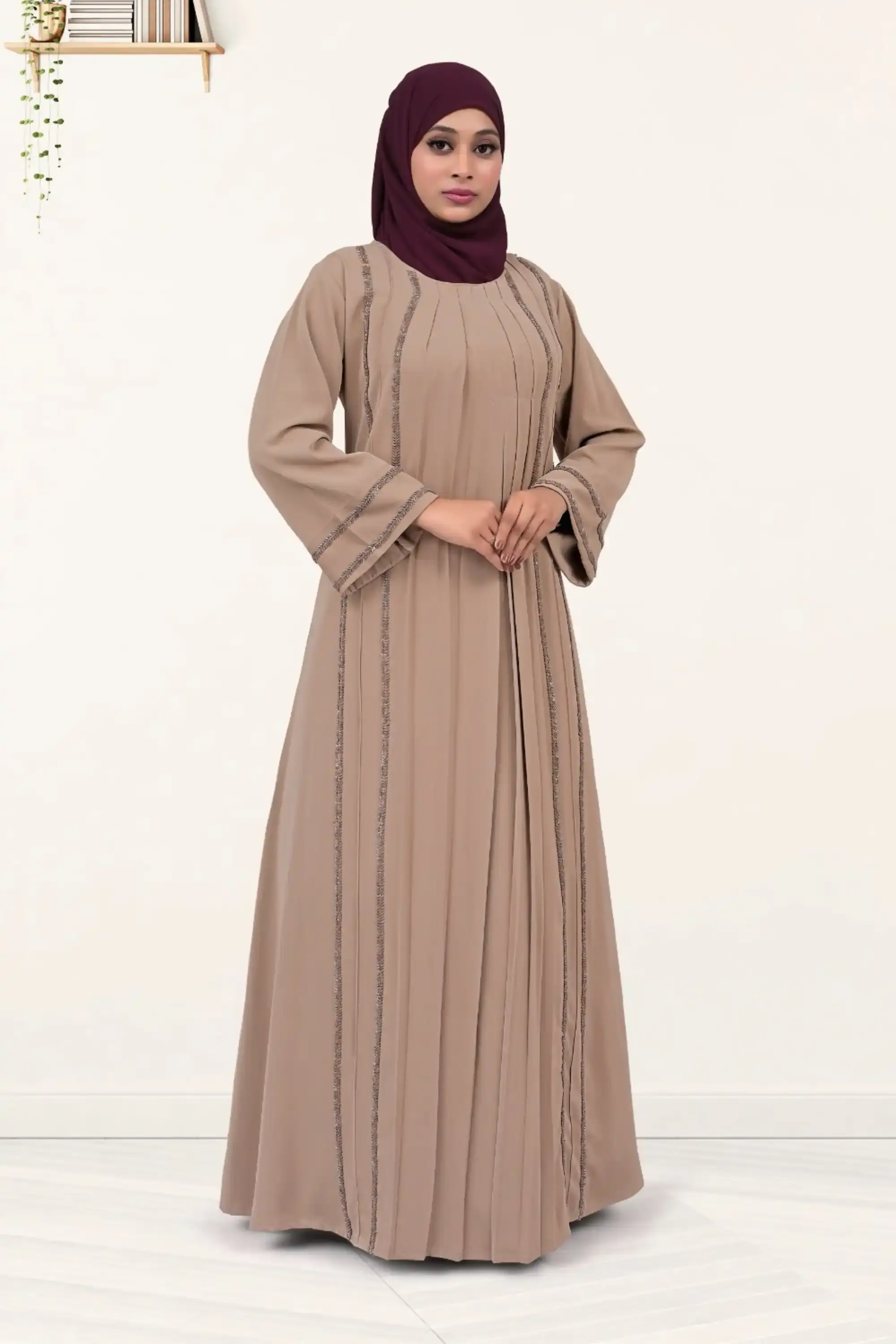 Full-length Nida fabric abaya with hand-embroidered cutdana detailing and pleated center design.
