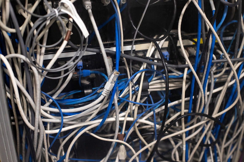 Network switch with many messy connected ethernet cables Maintenance of complex network in