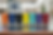 Seven insulated tumblers in orange, blue, black, yellow, teal, purple, red.