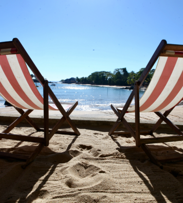 Deck chairs on beach at 293 Komba Guest Lodge, Madagascar