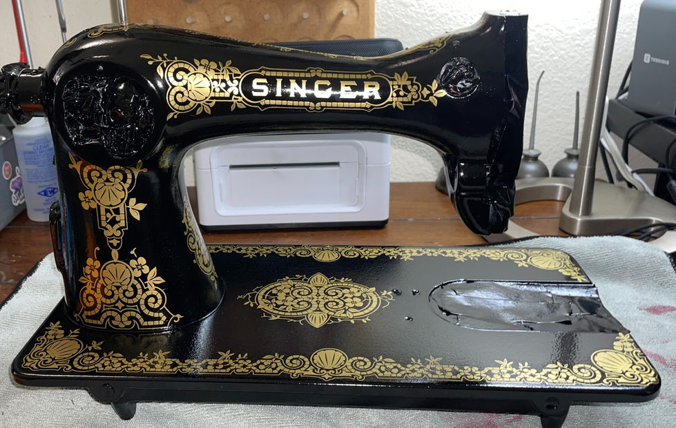 Vintage Singer 115 sewing machine with new waterslide gold decals waiting to be clear coated then put back together by Rins Restorations in Richmond TX.