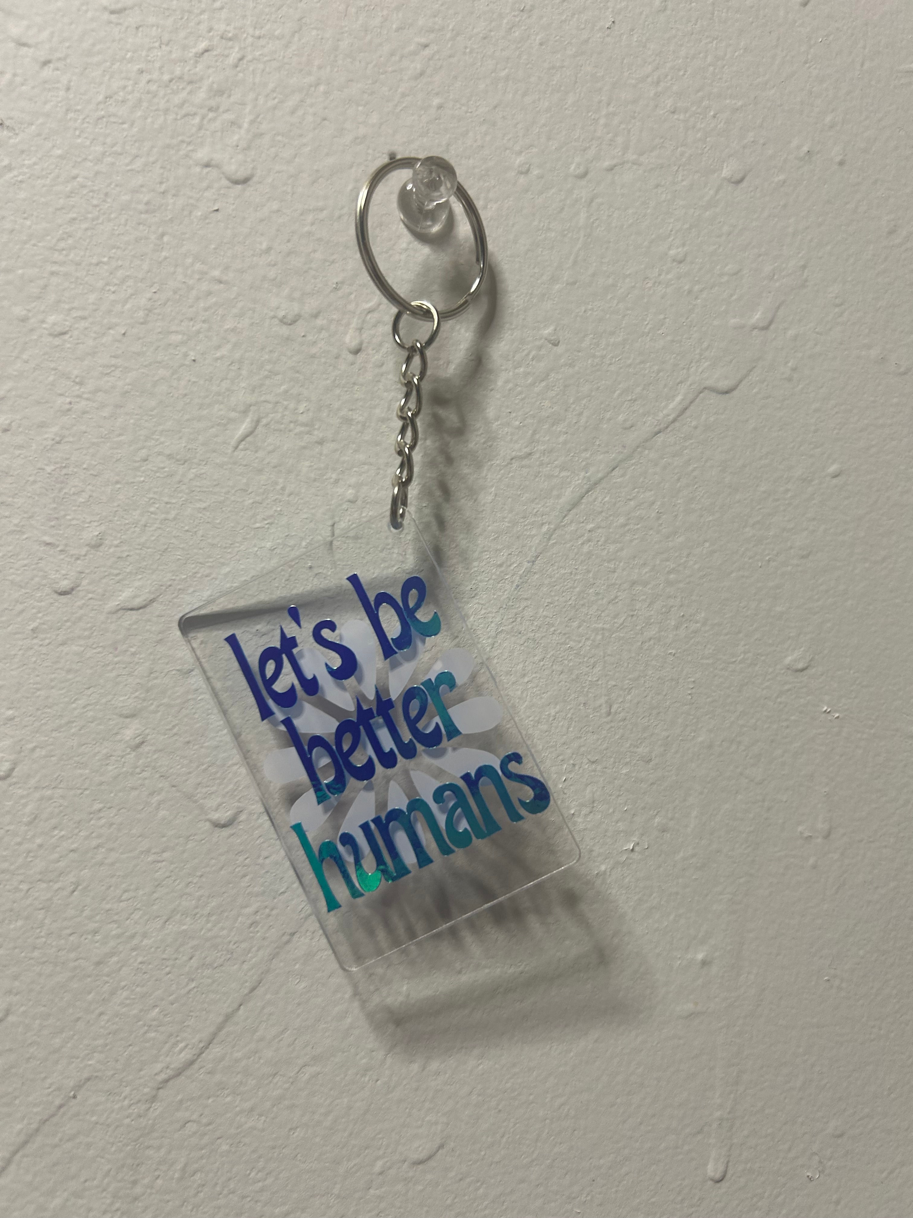 Let's be better humans - Clear Keychain