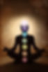 Yoga man in lotus pose with chakra symbols.jpg