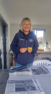 Ambassador organizing handouts.