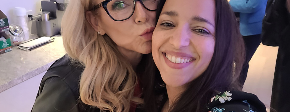 Amberly Lago kissing Michele Roys with the background of the studio she was recording
