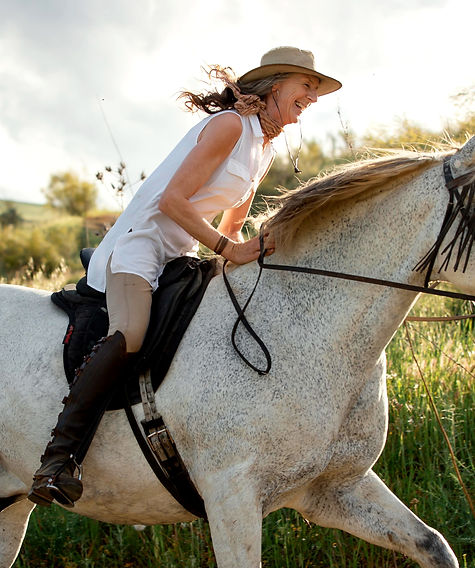 side-view-female-farmer-horseback-riding-outdoors-nature_edited.jpg