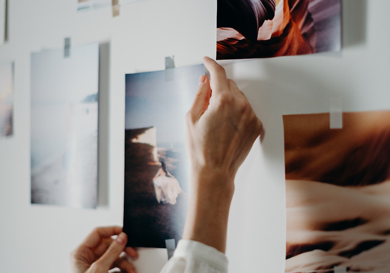 photo-of-person-putting-photo-on-wall-35
