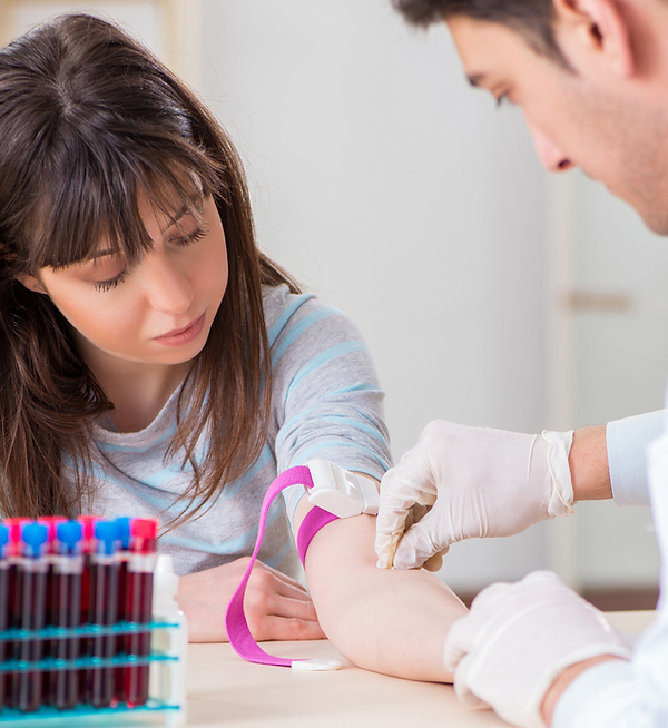 FAST LABS IMAGES man drawing blood young woman.png
