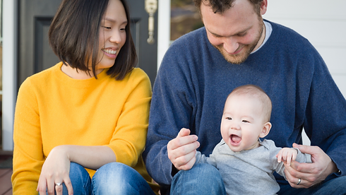 couple with baby on porch.png