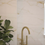 Thumbnail: Gold faucet against HARLEM MIDNIGHT 15X45 marble tile