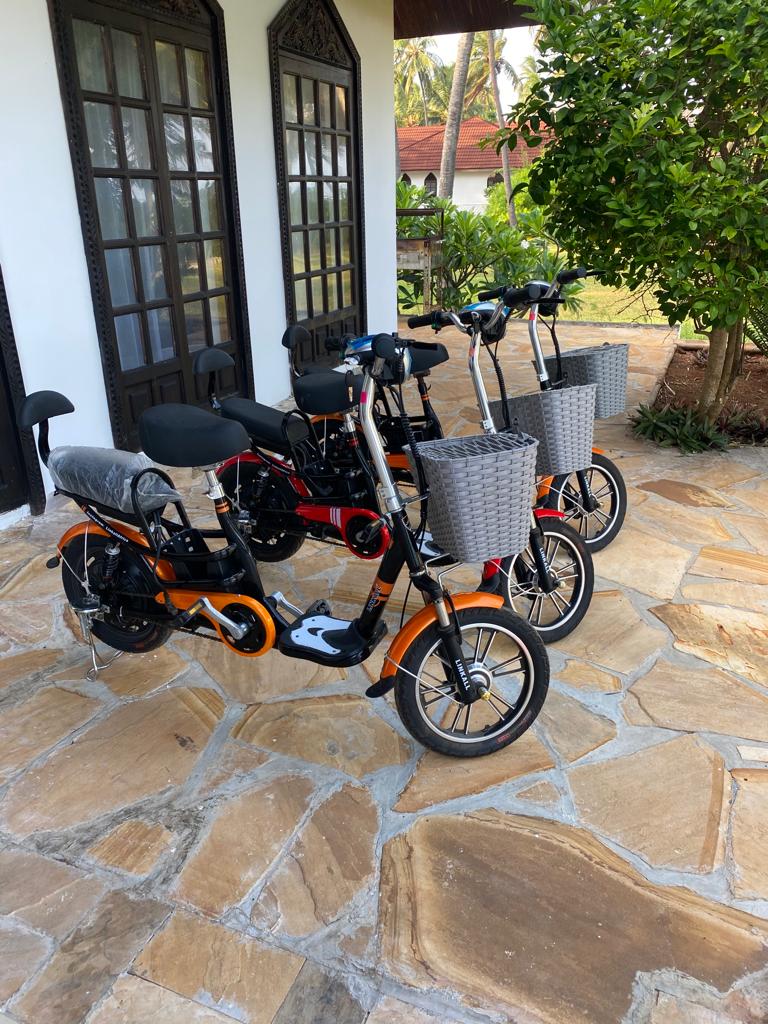 Electric scooters and bikes at Garden Beach Villa