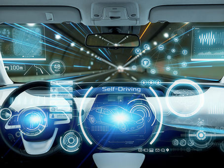 Futuristic self-driving car interior with glowing HUD screens, speed readout, and road data on a tunnel drive.