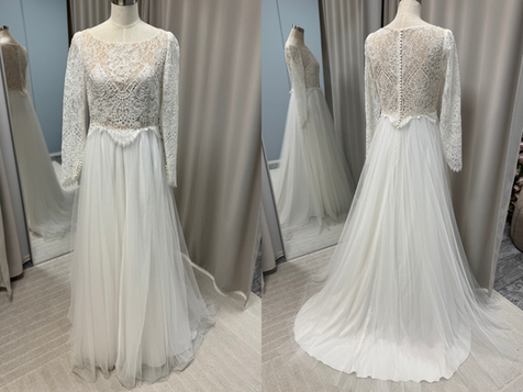 Heidi Tuisku Bridalin käyttämätön poistokappale. Romanttinen pitsiyläosa pitkillä hihoilla, peitetyllä selällä ja tyllihelmalla. Koko 40, hinta 800€.