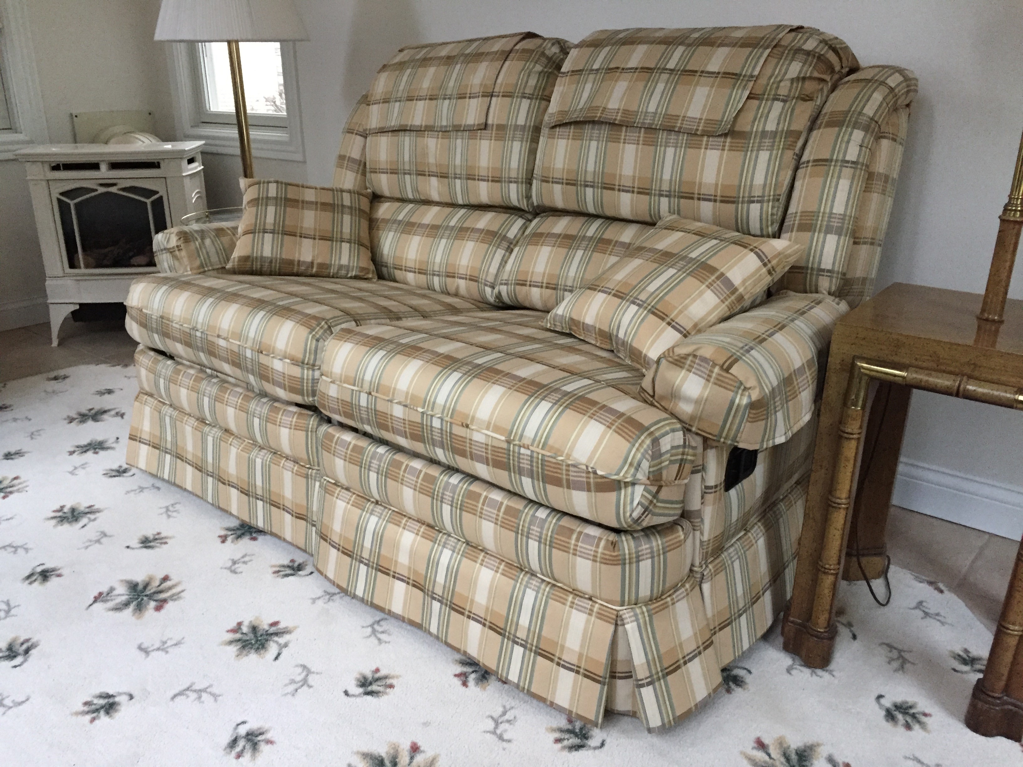 Upholstery of a sofa with mechanical