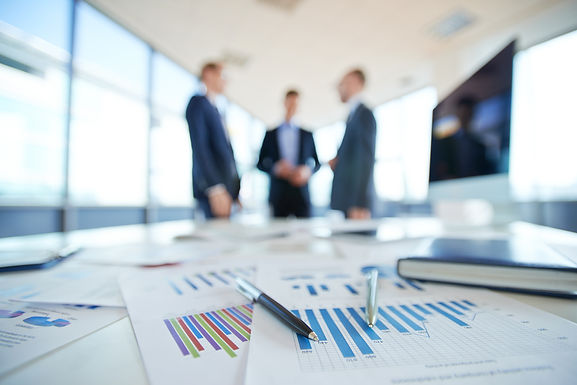 graphs with men in background.jpeg