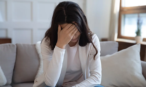 Upset young woman sit on couch in living.webp